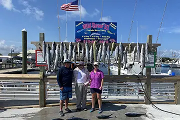 Wild Rover III charter guests with Mahi-Mahi and King Mackerel from full-day trolling trip near Carolina Beach